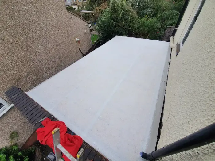Completed grey GRP flat roof on a rear extension
